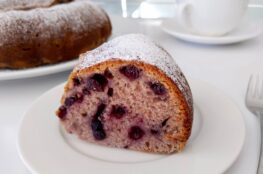 Slice of Latvian jam cake with blueberries