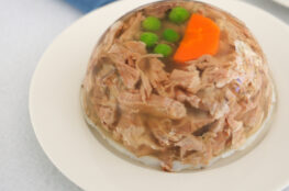 Galerts (meat aspic) on a white dish